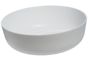 Empty white ceramic round salad plate on isolated background, a Food & Drink Photo by ndanko