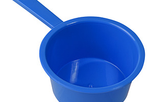 Empty plastic kitchen ladle of blue color with long handle, isol, an Abstract Photo by ndanko