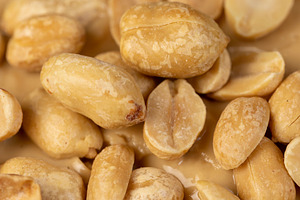 wheat bread with bran and soft peanut butter, peanut butter on a piece of bread, a Photo by rsoollAI