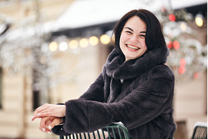 Happy woman posing on a chair with, a Person Photo by Rohan Photography