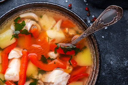 Fish soup with cod, red paprika, potatoes, tomatoes and parsley, a Food & Drink Photo by 5PH