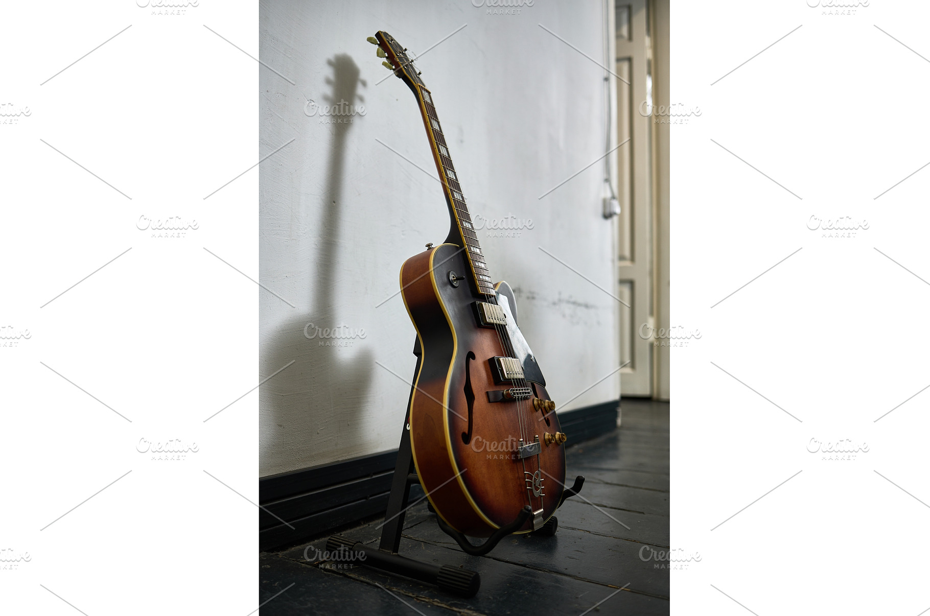 Vintage guitar standing on black, an Arts & Entertainment Photo by wip3out