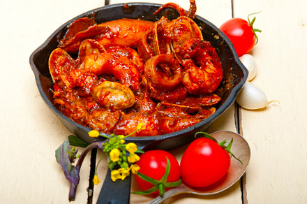 fresh seafoos stew on an iron skillet, a Food & Drink Photo by keko64