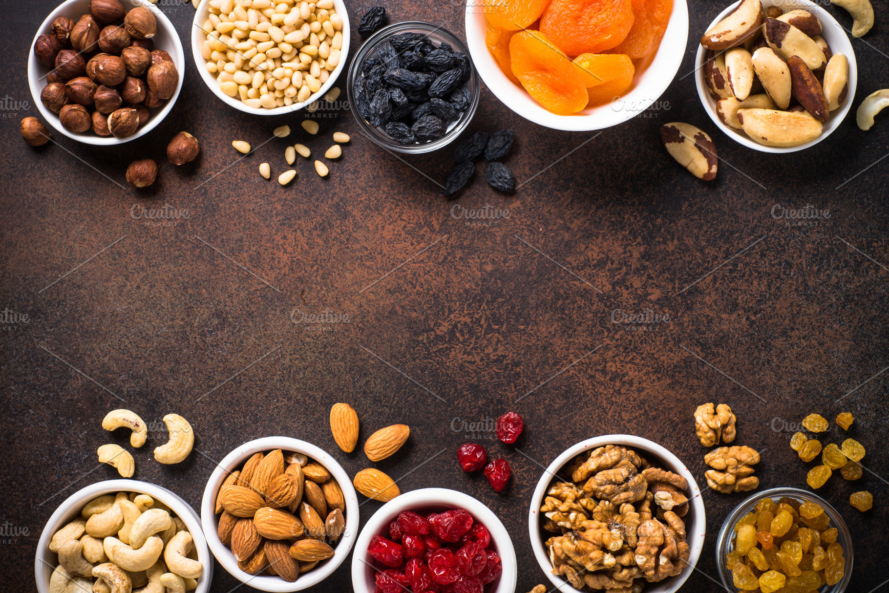 Nuts and dried fruits assortment on stone table top view stock photo, a ...