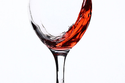 Splash of wine in a wineglass on a w stock photo containing red and splash, a Food & Drink Photo by Detriana