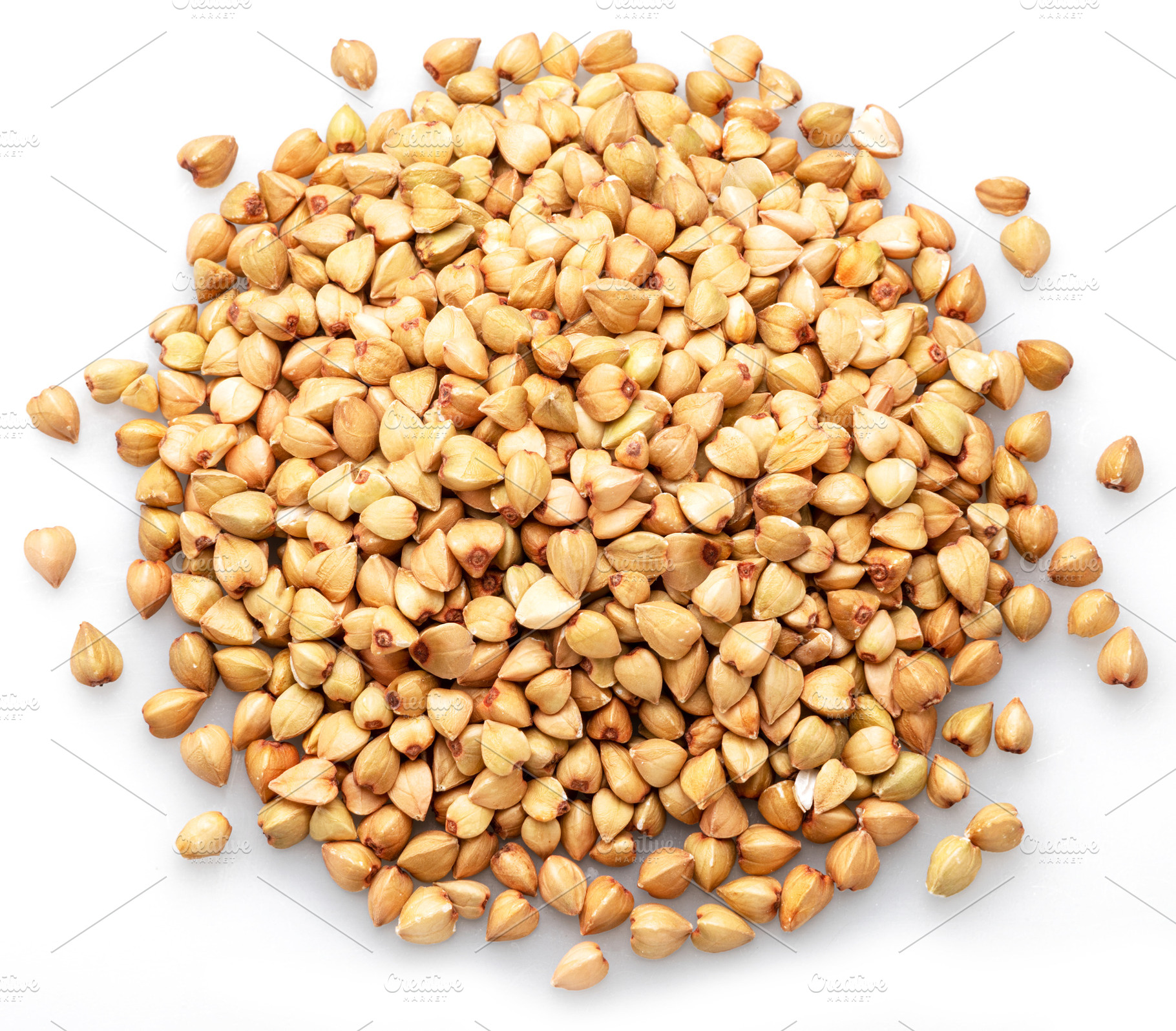 Hulled kernels of buckwheat cereal isolated on white background., a Food & Drink Photo by Volff