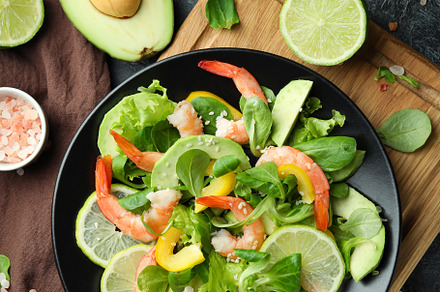 Concept of tasty eating with shrimp salad on black smokey backgr, a Food & Drink Photo by AtlasStudio PRO