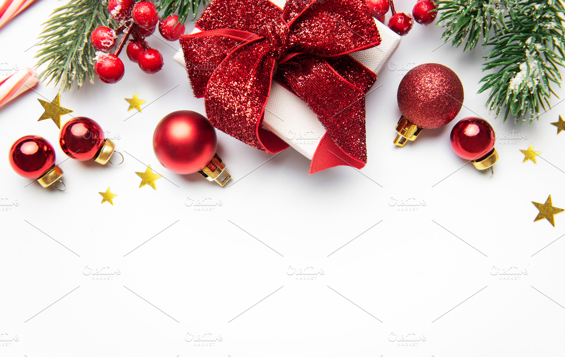 Christmas gift with red ornaments and pine branches, a Holiday Photo by Olena Rudo