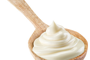 Handful of mayonnaise in wooden spoon on white background. File, a Food & Drink Photo by Volff