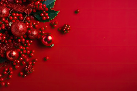 Christmas red background with Christ, a Photo by SaroStock