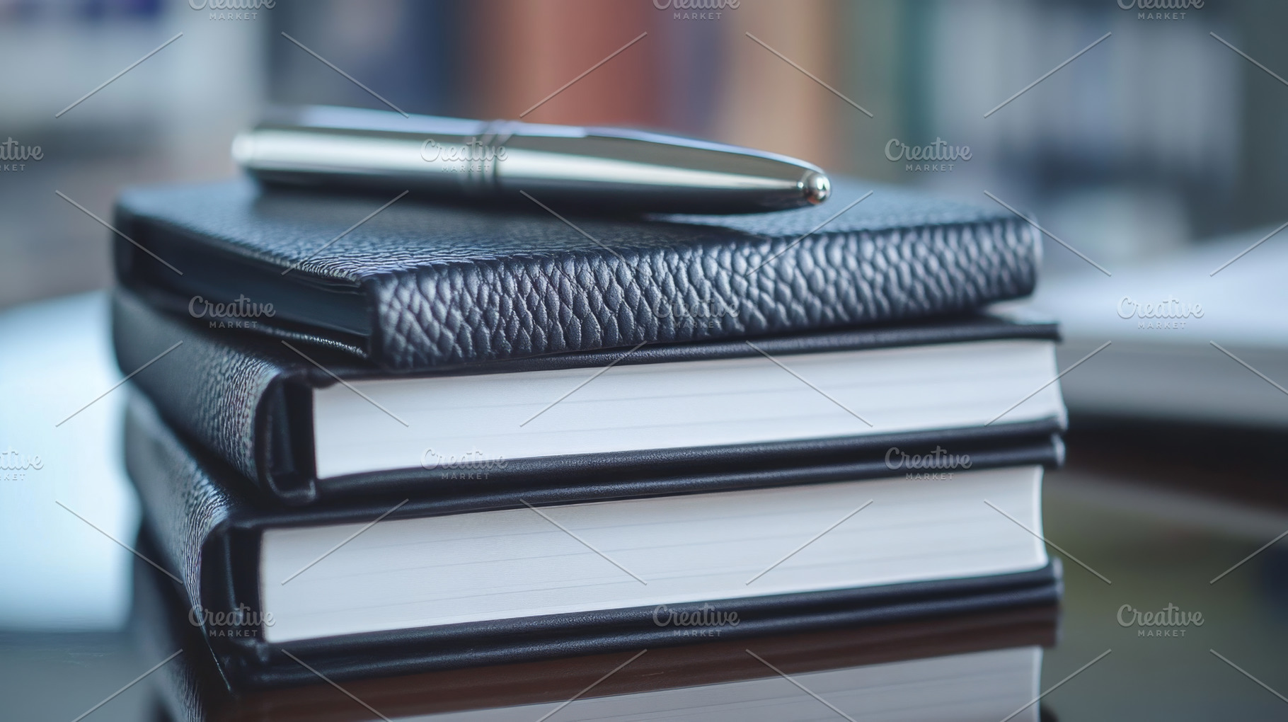 Elegant Silver Pen on Leather Notebooks Stack Close-Up, an Abstract Photo by Natalia Klenova's Shop