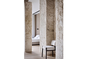 Modern minimalist bedroom with stone, a Background Photo by Lermont51