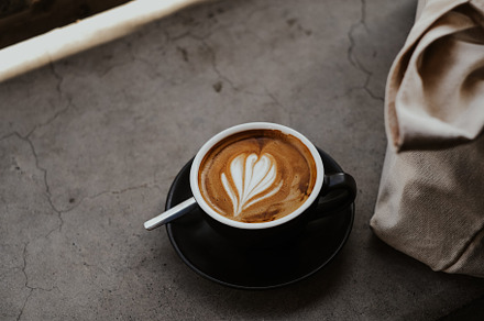 A cup of coffee on concrete, a Food & Drink Photo by Valeriia Miller