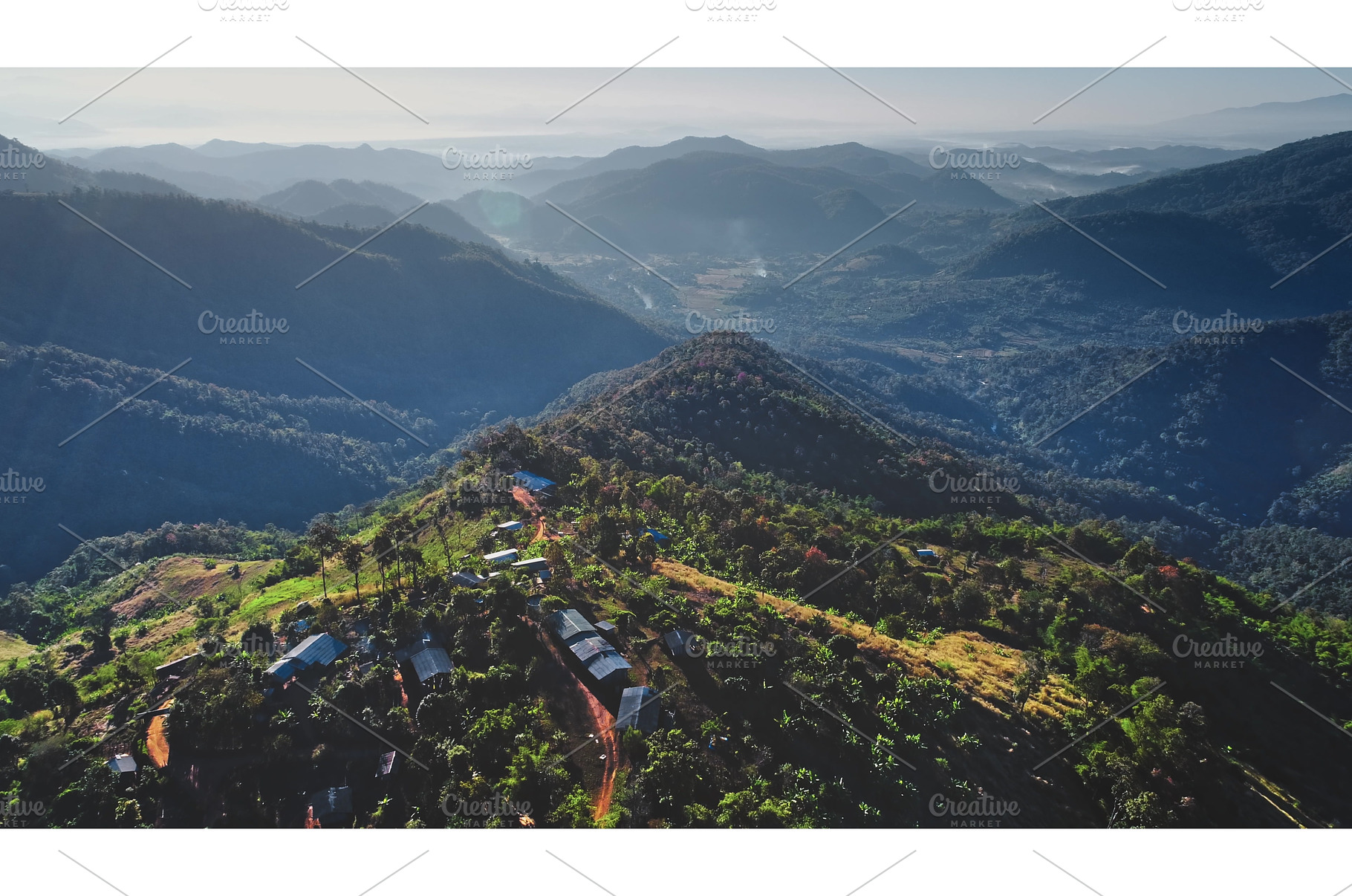 Aerial view of small village nestled, a Nature Photo by Goinyk