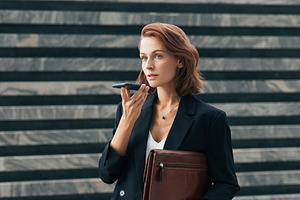 Confident business woman recording, a Person Photo by Artem Varnitsin