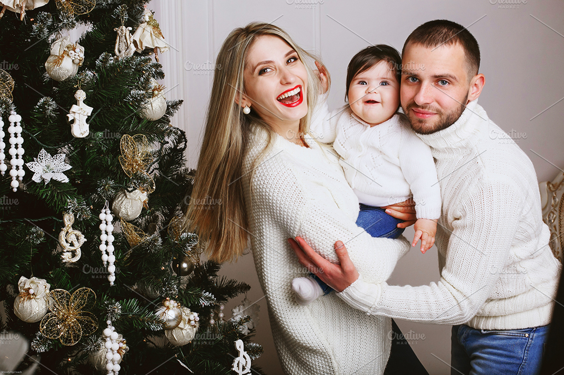 Young happy family stock photo containing family and happy, a Holiday Photo by IvashStudio