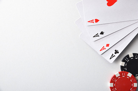 Aces and chips for betting isolated on white table, an Arts & Entertainment Photo by Davizro's Market