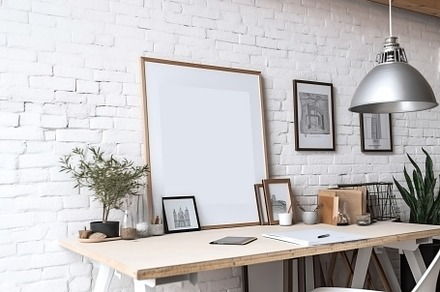 Blank print frame mockup with plants and decor on light backgrou, a Photo by Dvoevnore photos