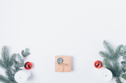 Christmas gift box next to fir branches, a Holiday Photo by progressman