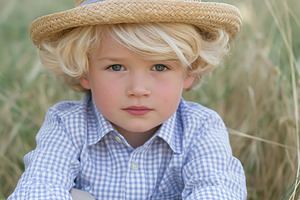 Young boy with blond hair and blue eyes wearing a straw hat and, a Person Photo by Studio ANNA