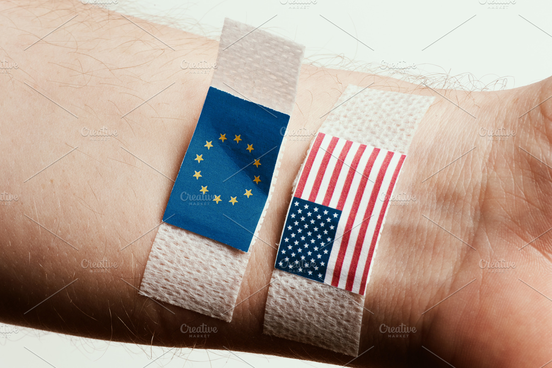 Partially Detached EU Flag Bandage with USA Flag, a Business Photo by Alliance Images