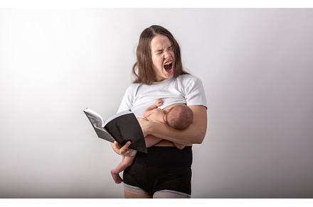 Beautiful young mother breastfeeding featuring child, mother, and care