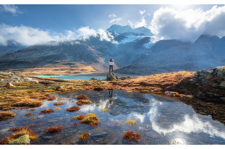 Young woman standing on a rock near