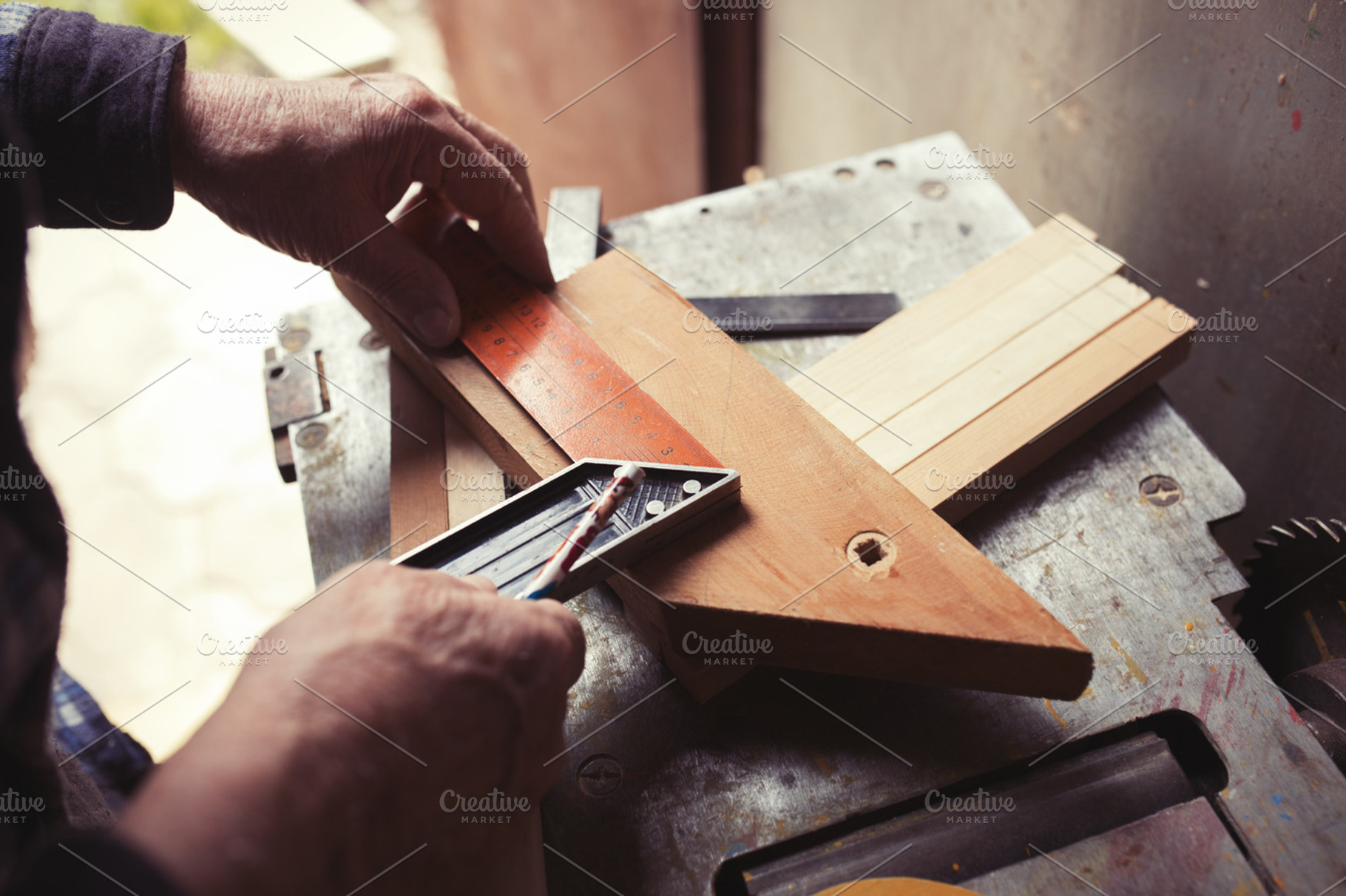 Old carpenter taking measurement featuring diy, hand, and woodworking, an Industrial Photo by Maksimkostenko