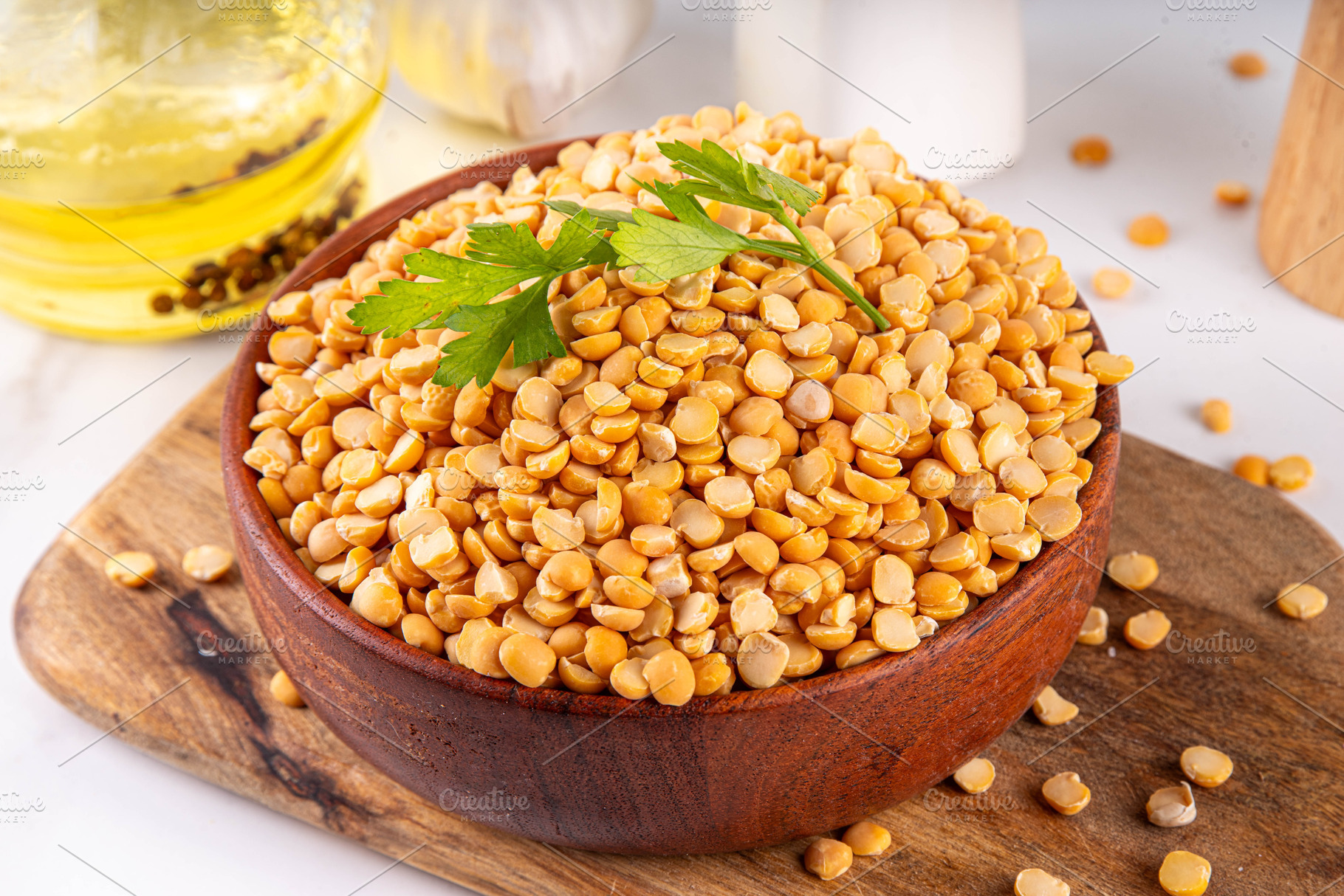 Dried yellow peas in wooden bowl, a Food & Drink Photo by Rimma