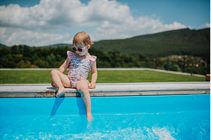 Little girl enjoying summer by the