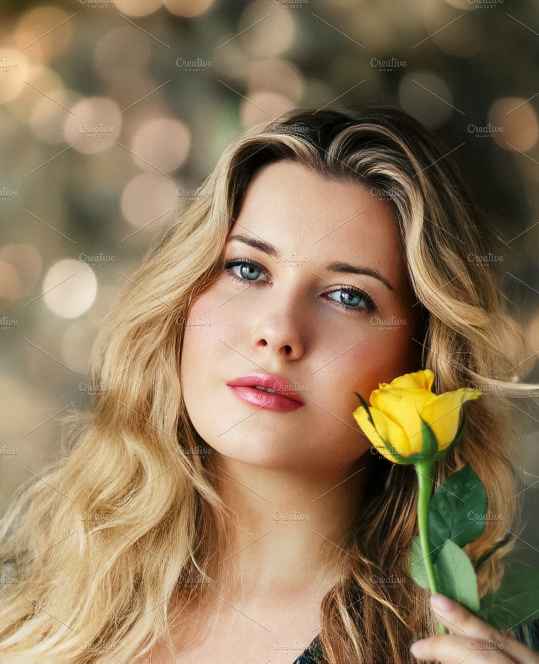 Beautiful woman holding a fresh yellow rose, looking at camera w, a Person Photo by Studio ANNA