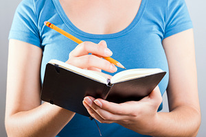 Woman Writing In Notebook, a Person Photo by THP Creative