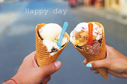 Beautiful bright ice cream with different flavors in the hands of a couple, a Person Photo by Artsaba Family