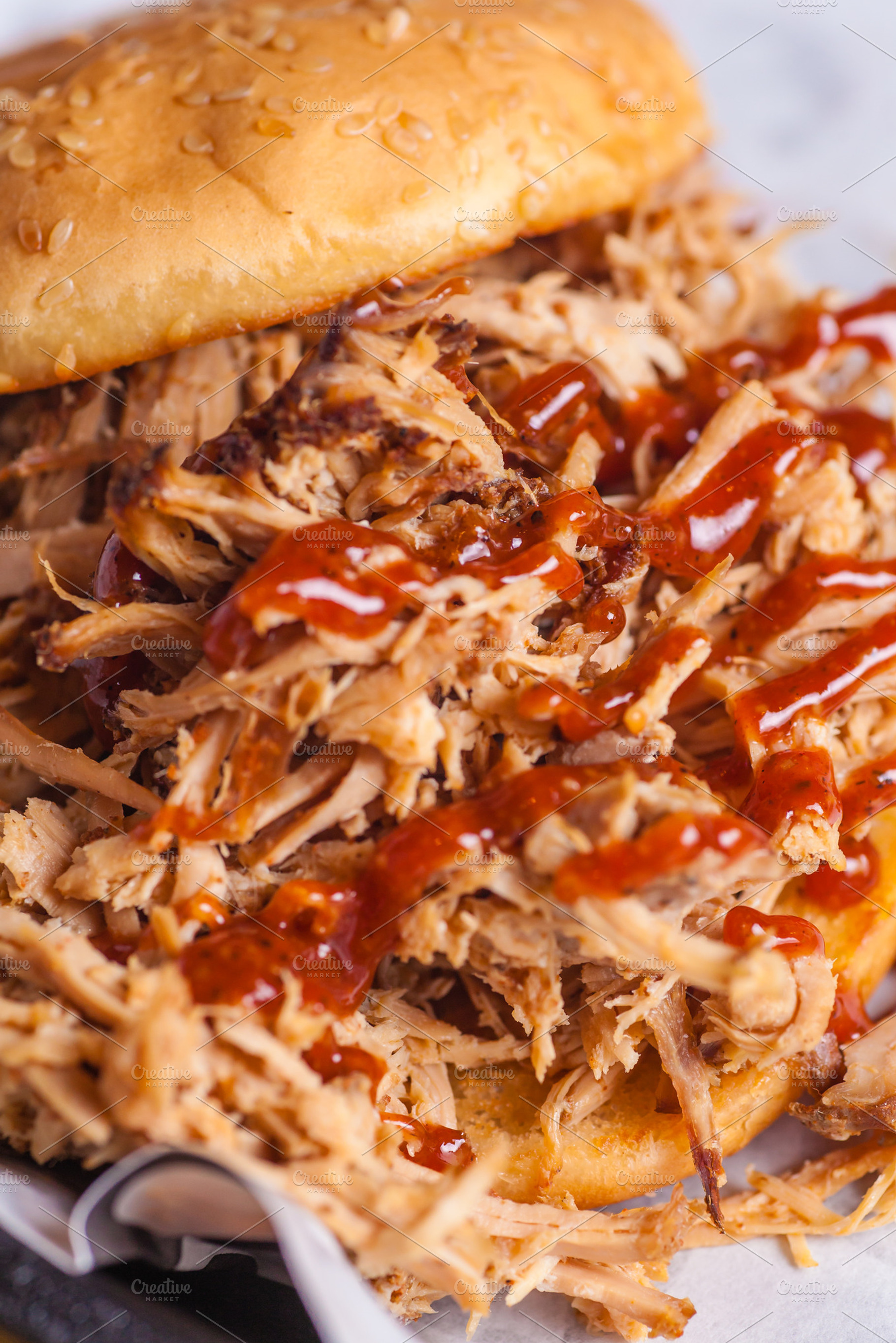 Pulled pork sandwich close up featuring appetite, barbeque, and bread, a Food & Drink Photo by Hidden Hallow