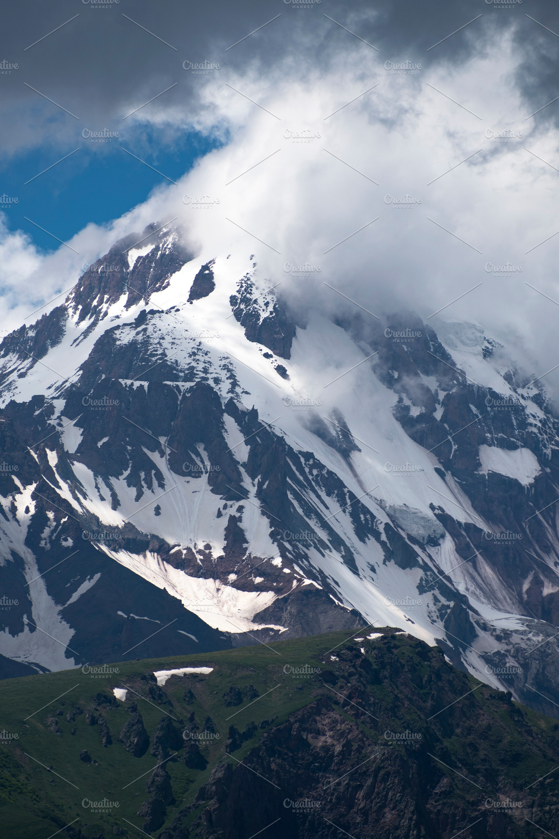 Vertical view of high Mount Kazbek peak with storm clouds and sn, a Photo by Pictures for you!!!!!!!!!