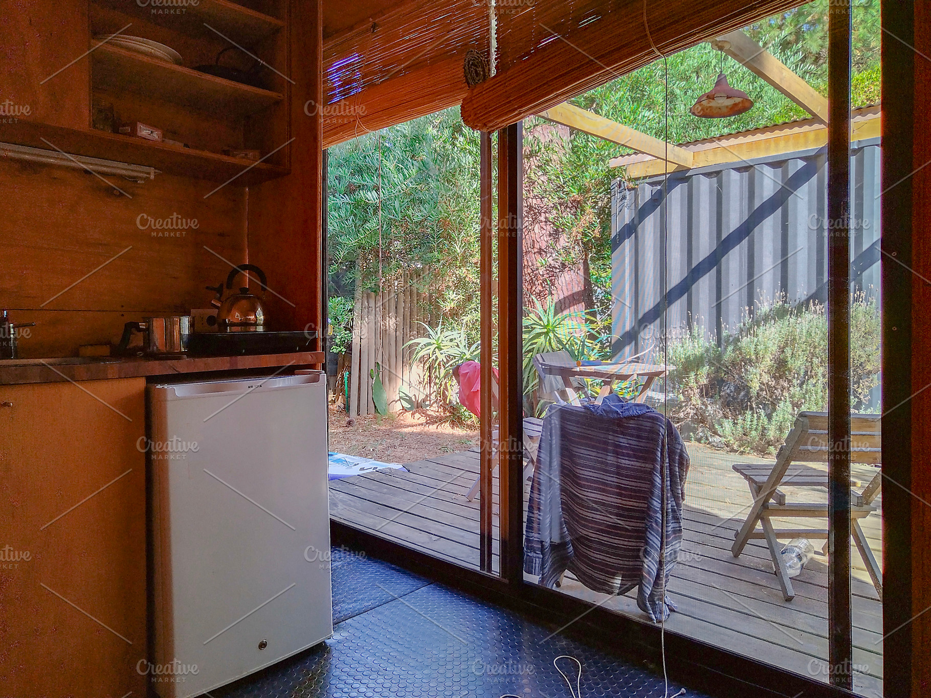 Cozy rustic wooden room with sunlight pattern, an Architecture Photo by DanFLCreativo