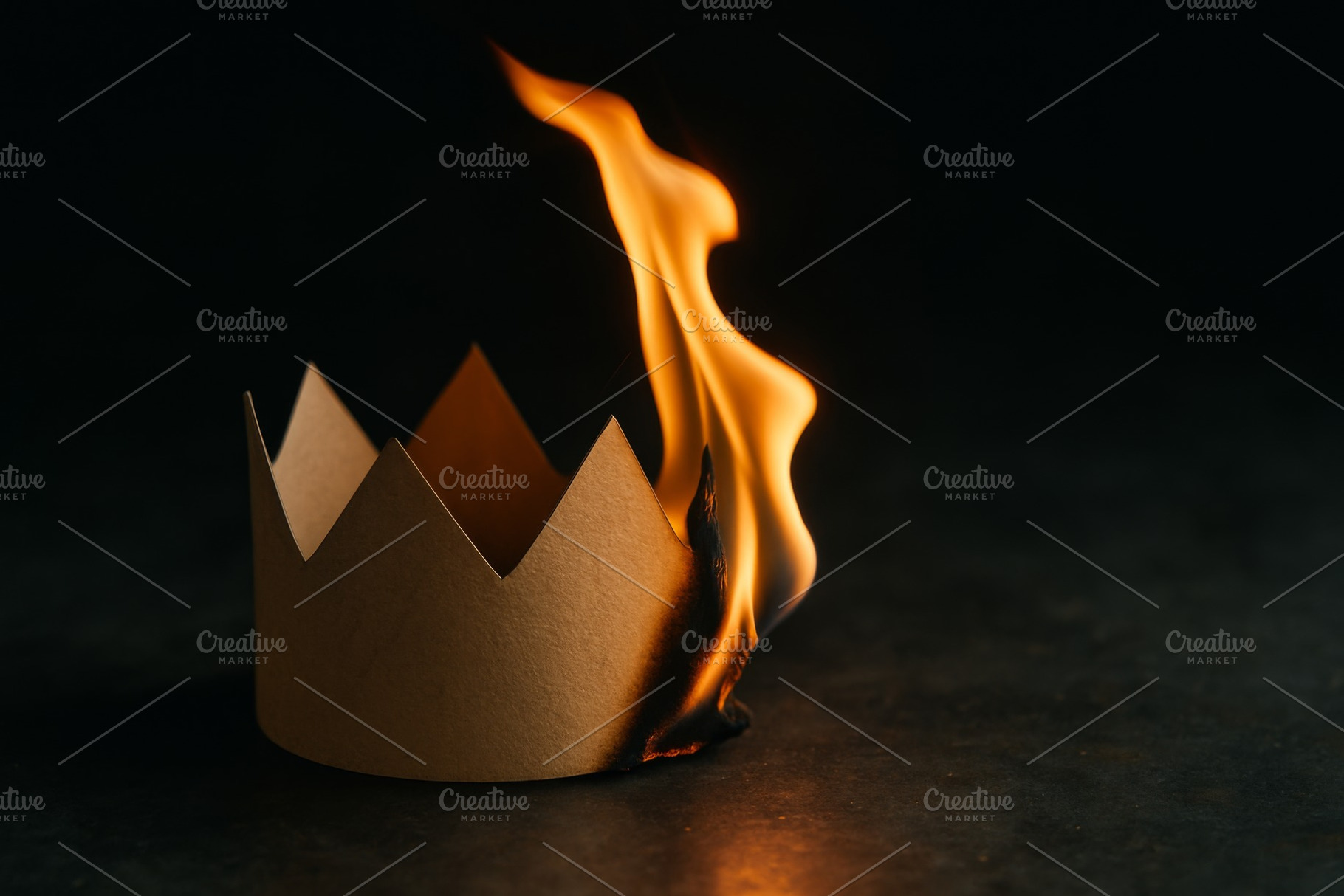 Burning paper crown symbolizing rebe, a Photo by Dvoevnore photos