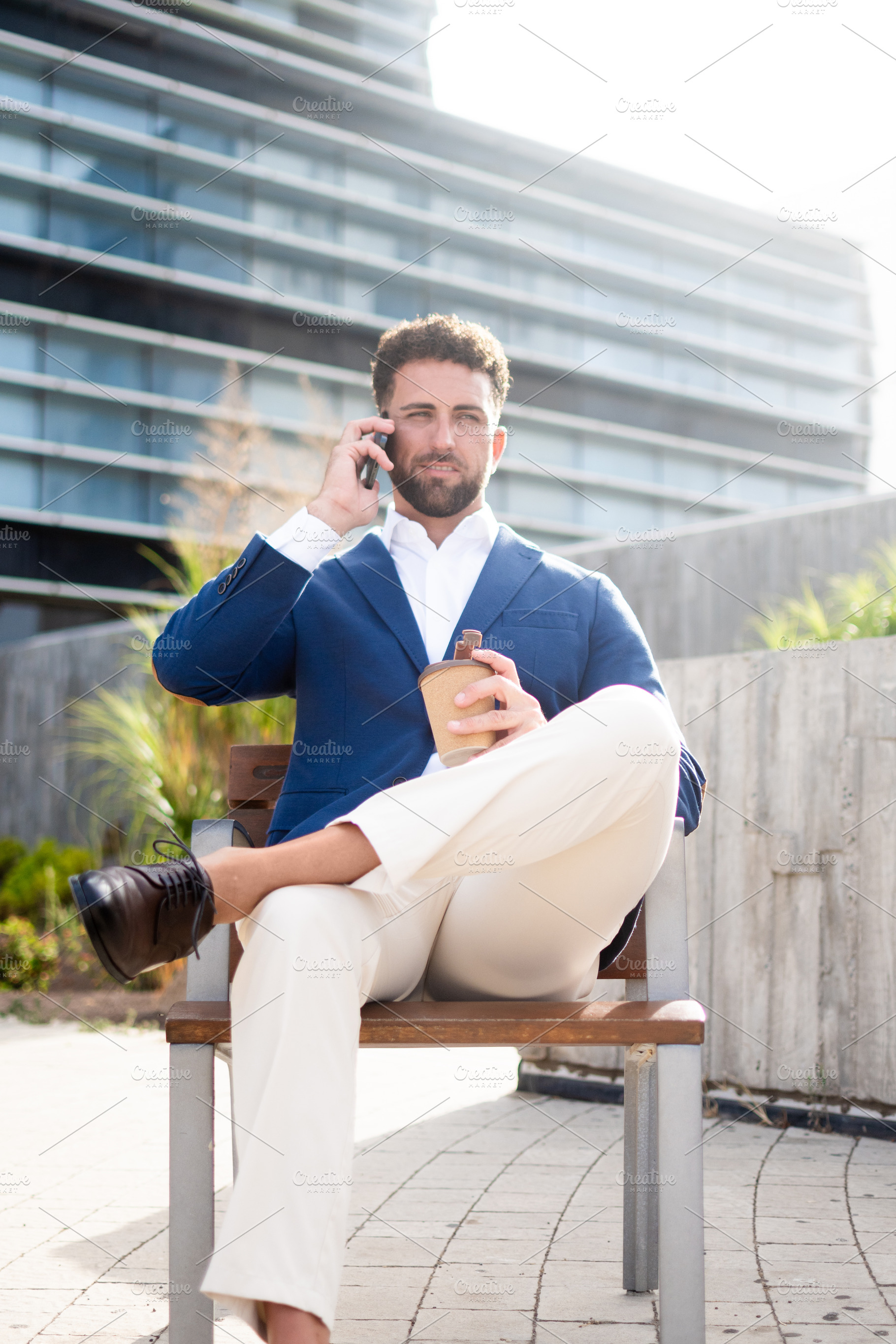 Businessman talking on phone during coffee breakDescription:, a Business Photo by etorres69