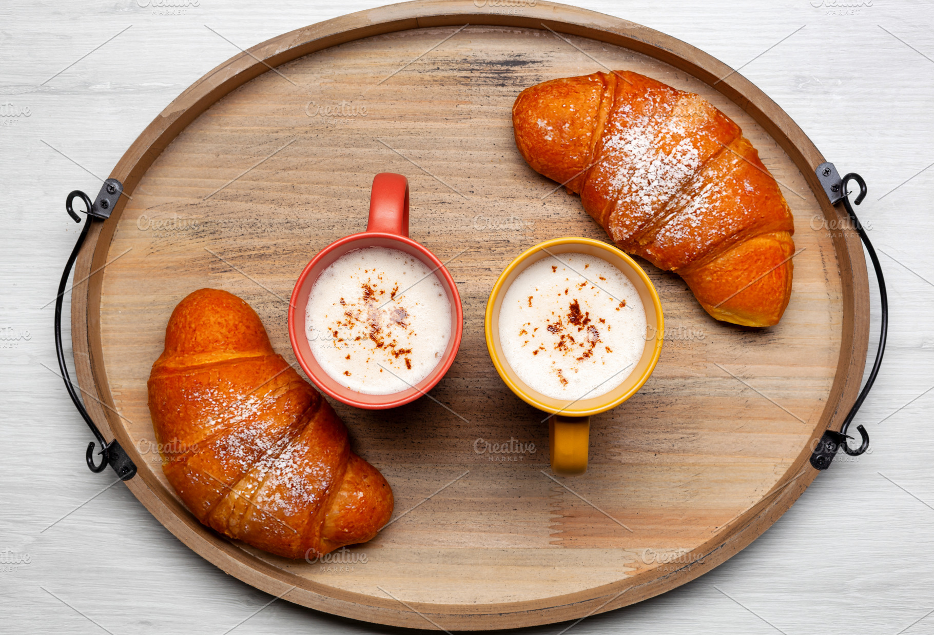 Delicious breakfast with two mugs of cappuccino and two croissants on wooden tr, a Food & Drink Photo by Antonio Gravante Market