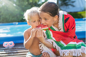 Sister and toddler brother eating, a Nature Photo by HalfPoint
