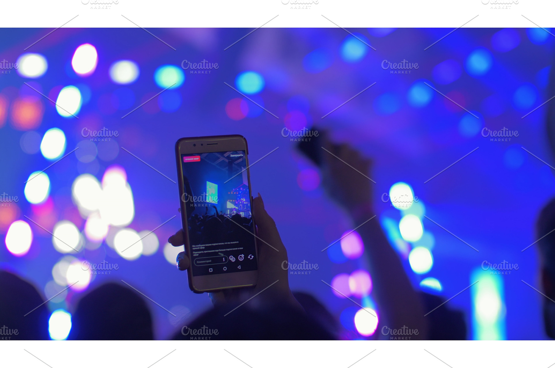Cellphone recording video during a, a Person Photo by Grey Coast Media