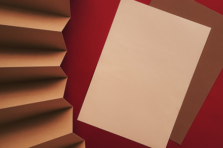 Beige and brown A4 papers as office stationery flatlay, luxury b, a Business Photo by Anneleven