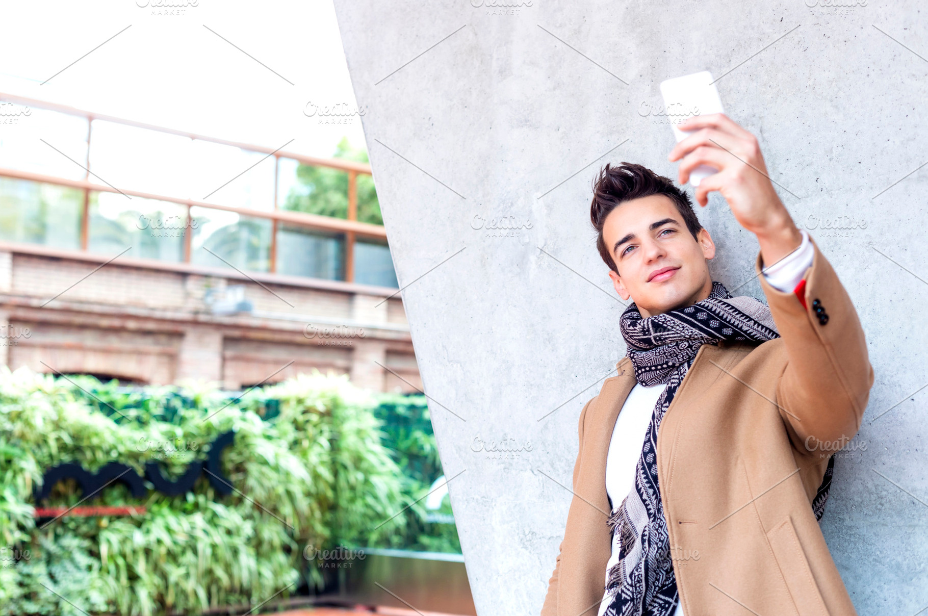 Young man taking selfie outdoors in winter outfit, a Person Photo by RF Images