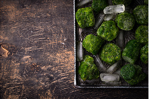 Frozen spinach green cubes in bowl, a Food & Drink Photo by Yulia Furman