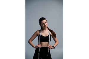 Young woman smiling, wearing black, a Sports & Recreation Photo by volodymyrshtun13795
