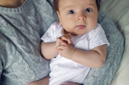 Mom in a sweater holding in his hand stock photo containing baby and mother, a Person Photo by SaulichPhoto