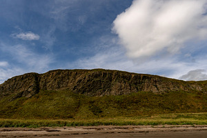 Rocky coastal cliff with grass under, a Nature Photo by Elena Vagengeim