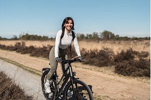 Golden hour ride with a smiling, a Sports & Recreation Photo by AD Stock Images