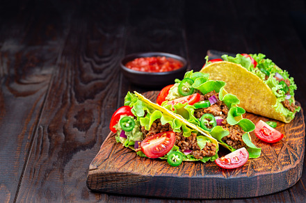 Taco with ground beef meat, mashed a, a Food & Drink Photo by iuliia_n