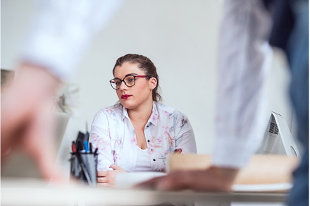 Beautiful plus size woman working on, a Business Photo by HalfPoint